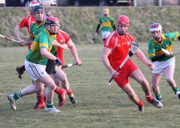 Ballyvarley's Paul O'Neill breaks through the Ballela defence for another score