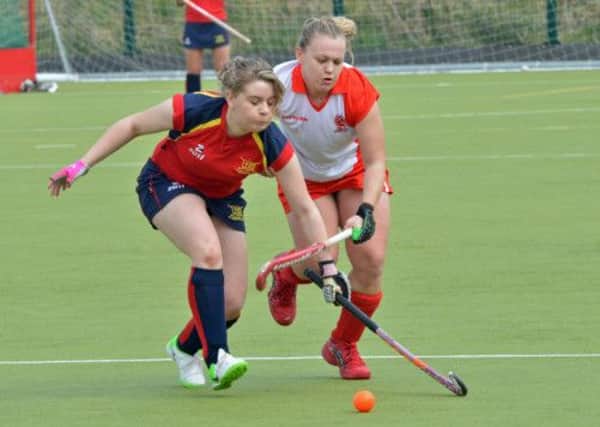 Jade Purdy of Ballyclare Ladies and Michelle Finlay of Larne Ladies chase the ball in their game at Greenland. INLT 16-004-PSN