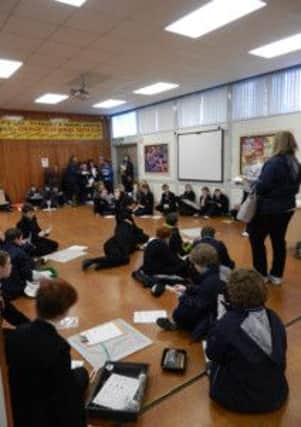 Year 8 and P 7 pupils receiving instructions from Miss McCullagh, Science teacher at Limavady High School