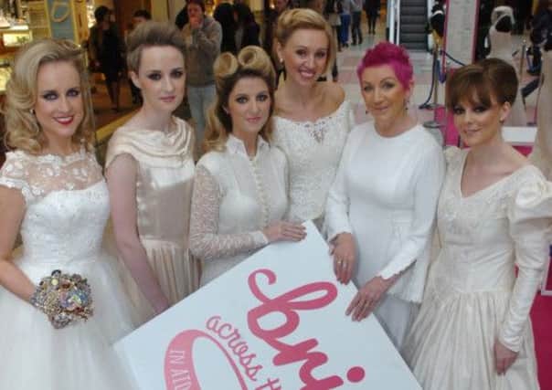 Modelling at the fashion show in Foyleside Shopping Centre for the Foyle Hospice Brides Across the Bridge record attempt on the 27th April are, from left, Jane Veitch, Hannah Vail, Marie Martin, Ewelina O'Donnell, Maire Cassidy and Catriona Cooper. People can register in person or by phone for the event in Guildhall Sqaure at the Foyle Hospice, Yellow Moon, The Coffee Cup Buncrana and The Loaf Cafe Carndonagh. INLS1613-173PG