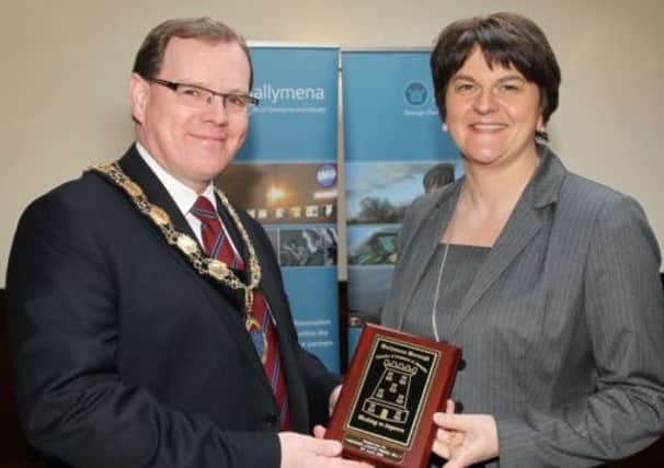 President of Ballymena Chamber of Commerce & Industry Thomas McKillen makes a presentation to  Minister of Enterprise, Trade and Investment Arlene Foster MLA who was guest of honour at the Chamber's lunch in the Adair Arms Hotel.  INBT 16-111JC
