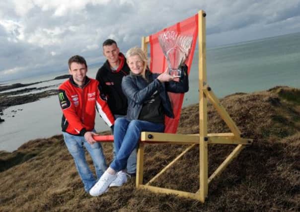 PACEMAKER, BELFAST, 17/4/2013: North West 200 stars William Dunlop, Martin Jessopp and Maria Costello are pictured with the new Superbike race trophy on the North Coast today. The feature Superbike race will have the new trophy and a new sponsor for 2013 with Vauxhall adding the race to their portfolio of title and Thursday Supertwin race support.
PICTURE BY STEPHEN DAVISON