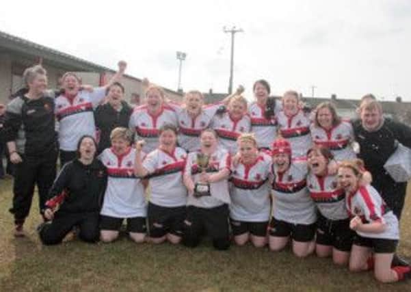 Carrick Ladies RFC celebrate promotion to AIL Division Two following their victory over Ballymoney. Photo: Gary Watters
