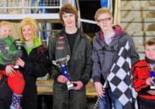 Dean McCrory receives the Junior Rod Next Gen Cup from PMF Contracts representative Cormac McFerran. Cara Wightman (left) finished second with Antony Kincaid in third. Picture: Davy Park.