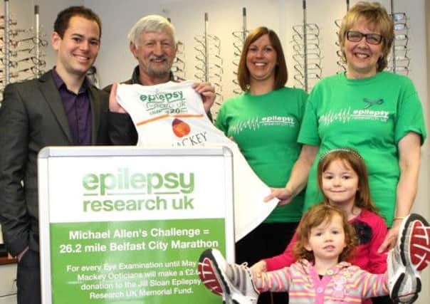 Michael Allen of Mackey  Opticians, Carnmoney gets a helping hand to prepare for his Marathon Run on May Day from his Father-in-law Robin Simms, wife Caroline Allen, Mother-in-law Edith Simms and his daughters Megan (2) and Cameron (6). INNT 14-035-FP