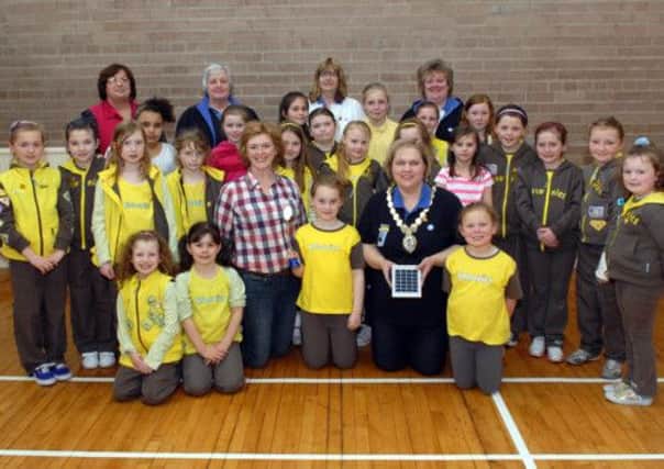 Joanne Harris, president and Jillian Patchett, past president of Soroptomist International of Lurgan with members of Second Lurgan Brownies, St John's Parish Church, who are completing their world issues badge and helping with the Soroptomist solar light project for Zambia. INLM17-106gc