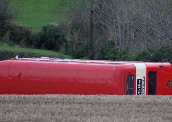 Fourteen people were taken to hospital after a double-decker bus carrying a party of wedding guests overturned on Saturday afternoon on the Ballynahinch Road near Lisburn. Picture: Cliff Donaldson