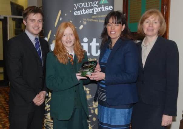 Friends School pupil Charlotte McCausland who has won the Young Enterprise Young Entrepeneur of the year award in the South Eastern area through the Company Programme for 2012/13. Included are Mr Gareth Davidson, business studies teacher, Suzanne Lutton, chair of the South Eastern Young Enterprise Board, and Miss Elizabeth Dickson, Friends School principal. Charlotte will now go forward to the Northern Ireland finals. INUS1713-FRIENDS