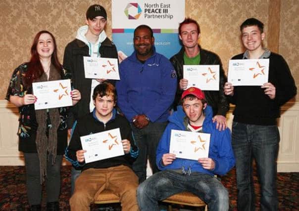 WELL DONE...Young people from Coleraine with their Detached Youth Project certificates. They are joined by project worker Tommy Van Wyck .