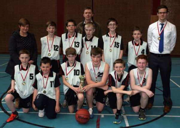 The Ballymena Academy team who won the Ballymena Schools Year 8 basketball tournament, pictured with Katrina McCaughan (Council Sports Development Officer), Ryan Hayes (coach) and Paul McKee (tournament organiser). INBT18-216AC