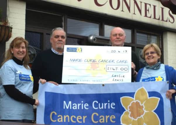 Pictured, from left, are Cara Ferguson, Sixmile Marie Curie Fundraising Group, Leslie Lewis, charity night organiser, John McConnell, McConnells of Doagh and Sharman Finlay, Sixmile Fundraising Group. INNT 18-511CON