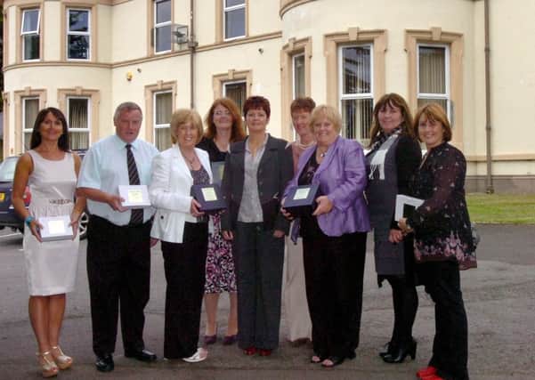 Staff from Belmont House who have over 25 years service taking part in the school's 50th anniversary celebrations. They are, from left, Lorraine O'Neill, Jim McDaid, Imelda Mallon, vice principal, Janet Peace, Nuala Begley, principal, Denise Jack, Jane Bryce, vice principal, Joan McDaid and Collette Nelis. INLS2111-181(S)