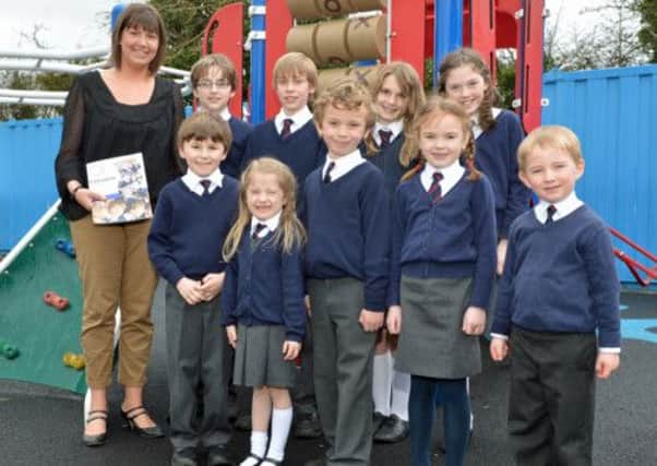 Fairview Primary School teacher Dawn Beattie with P1 pupils, Amalie, Harvey and Niall and P3 pupils, Heidi and Reece also P7 pupils, Matthew, Xander, Katie and Alexandra. INNT 18-009-PSB