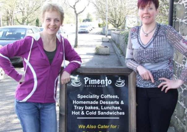 Irene McCaffrey, left, pictured outside Pimento Cafe in Moira with ?.