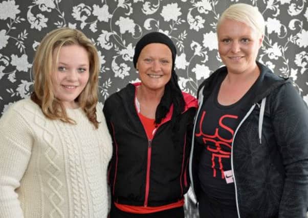 Kathy McClenaghan (centre) is pictured with her daughter Kerry-Anne and grandaughter Morgan who will be participating in the Belfast Marathon along with 12 work colleagues from Dunelm Mill on the Shore Road to raise much needed funds for The McDermott Cancer Unit at the Ulster Hospital at which Kathy is currently attending. INNT 18-020-PSB