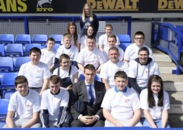 A section of the group visiting Everton pictured with Seamus Coleman ahead of the match against Fulham on Saturday. The Killybegs man starred in the 1-0 victory. Photo courtesy of Everton FC