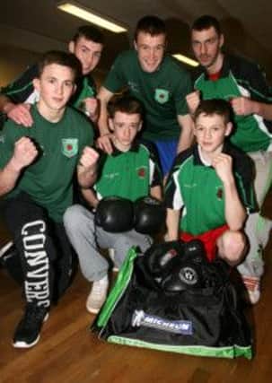 Members of All Saints Boxing Club with one of the bags sponsored by Michelin for their forthcoming trip to Boston and New York. INBT18-207AC