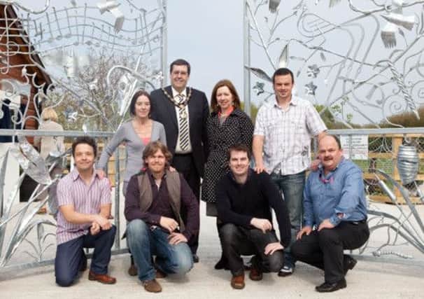 Pictured at the stunning new gates are: Front row: Jonny Kerr, Arts Development Assistant, Steven Murphy, Eamonn Higgins and John Milligan. Back row: Rita McGovern, the Mayor of Craigavon Alderman Stephen Moutray MLA, Dr Theresa Donaldson, Chief Executive of Craigavon Borough Council and David Martin.