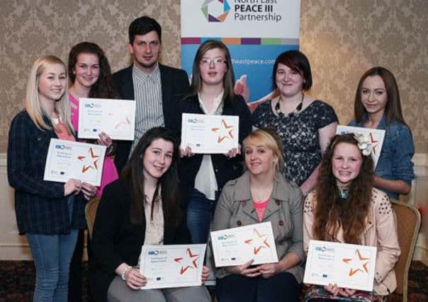 Young people from Ballymena South with their Detached Youth Project certificates. They are joined by project co-ordinator Neil Symington of NIYF and project worker Laura O'Hare .
