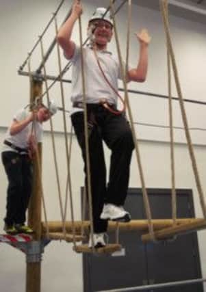 Trevor McCormick and Cain Taylor got to grips with the Activ8 Adventure ropes course when it visited Jordanstown School.