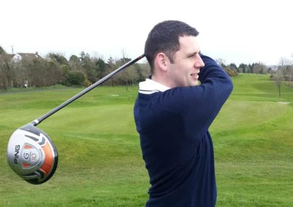 Adam Foreman admiring his tee shot at the fourth hole during his match in the Belfast and District Cup.