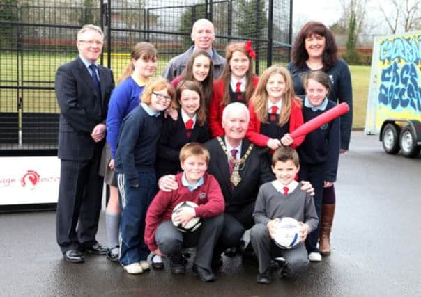 Councillor Sam Cole, Mayor of Coleraine, pictured with the local pupils who won the competition to design the artwork for Cage Sport. Included are, Mr. Wray, Irish Society Primary School principal, Stephen McCartney, Coleraine Borough Council, and Sharon Burnett, PCSP vice-chairperson. CR18-402PL