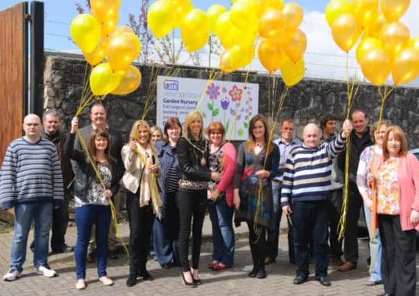 Staff and clients of AMH New Horizons service joined by Craigavon Mayor Carla Lockhart for the golden balloon release celebrating the charitys 50th anniversary year. INLM1913-02