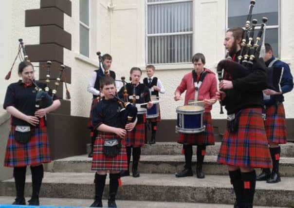 Members of Ballyboley Pipe Band. INLT 19-601-CON