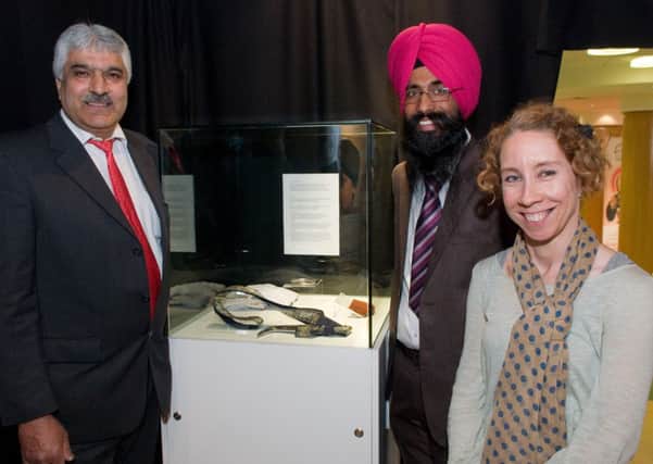 Pictured at the opening of the Sikh Fortress Turban exhibition in the Tower Museum are from left, Satnam Singh Gill, Satwinder Singh, facilitator and Bernadette Walsh, City Archivist. Picture Martin McKeown. Inpresspics.com. 1.5.13