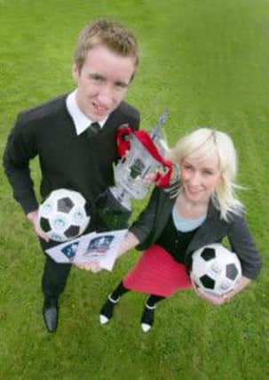Kieran Chappell, from Ballymena, receives his FA Cup final tickets from Sarah Ratcliffe, Budweiser Brand Manager.