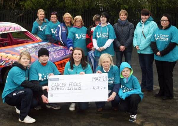 Rosie Forsythe, community fundraising officer with Cancer Focus, receives a cheque for £6313.01 from the ladies who took part in the special ladies race at Ballymena Raceway. INBT19-223AC