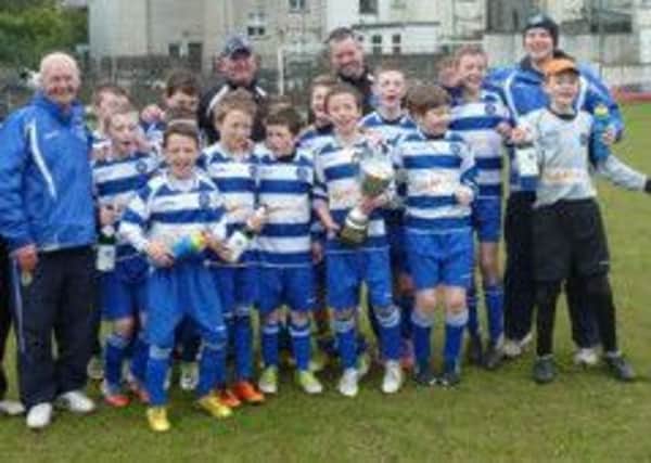 Northend U12s being presented with the League Premiership Trophy after their final home match against Newington on Saturday at Smithfield in the Belfast and East Antrim Youth League.