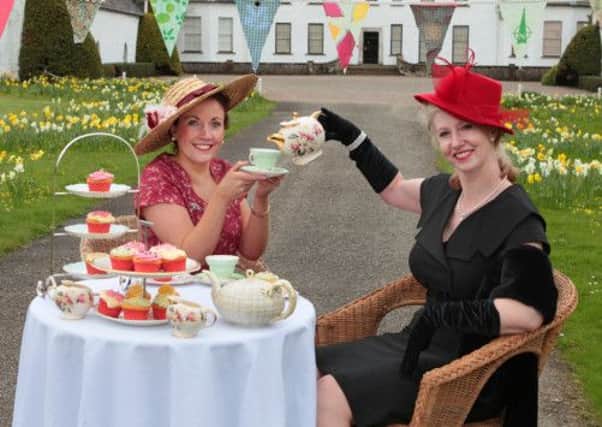 Getting into the swing of things are Paula Smith and Sherrie Henson sampling some of the scrummy homemade Cupcakes.       
Visit Springhill this May bank holiday where the beautiful National Trust property in Moneymore will come to life with the sights and sounds of a bygone era as it hosts a fantastic Vintage Fete. Any vintage fete would not be complete without a traditional afternoon tea. Visitors to Springhill on Sunday 5 and Monday 6 May will have the chance to enjoy freshly baked petit scones served with cream and local preserves, tasty traybakes, delightful cupcakes as well as a number of nostalgic attractions and vintage entertainment for all the family.  Picture by Bernie Brown