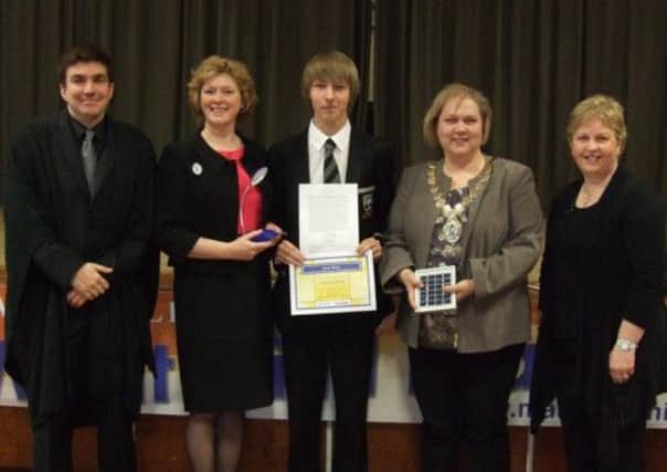 Pictured lift to right are James (?) Maxwell, principal of Markethill High School, Jillian Patchett, past president, pupil Zakk Gowing, Joanne Harris, president of Soroptimist International of Lurgan and Karen Kennedy, head of English at Markethill High School. INLM19-018