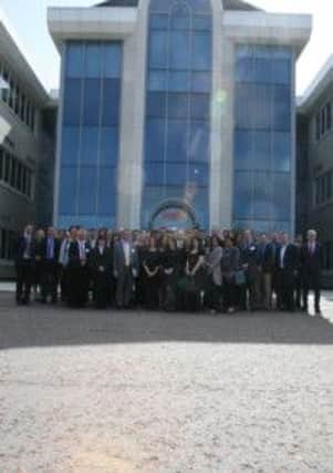 Invest NI's global staff outside the HML office in the Ulster Science and Technology Park. The owners of the park want them to promote the facility to investors worldwide.