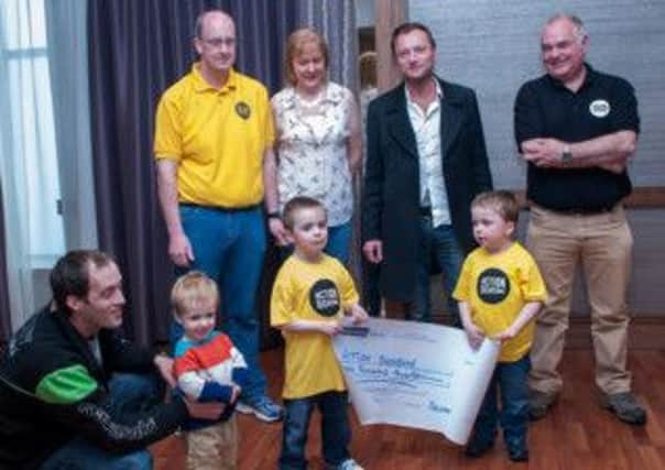 Game of Thrones actor, Richard Dormer (centre), met representatives of Leap for Luke and Action Duchenne at a special event following Belfast Marathon. Included in the picture are Luke O'Hanlon and his father Aidan from Derrytresk (far left). INTT2013-052X