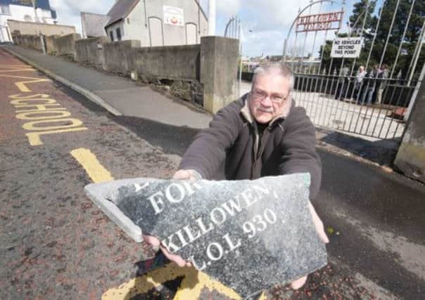 David Mc Ilreavy, Caretaker of Killowen Memorial Orange Hall shows some of the damage caused to a memorial stone during an attack on in the early hours of Saturday morning.
PICTURE:  MARK JAMIESON.