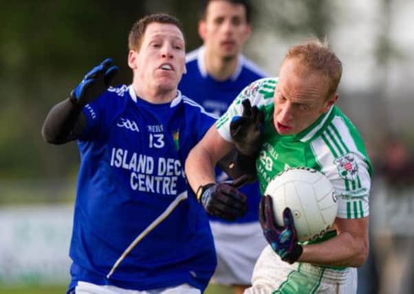 Brendan Quinn claims the high ball for Derrylaughan over Stephen McNally. INTT2013-700DCA