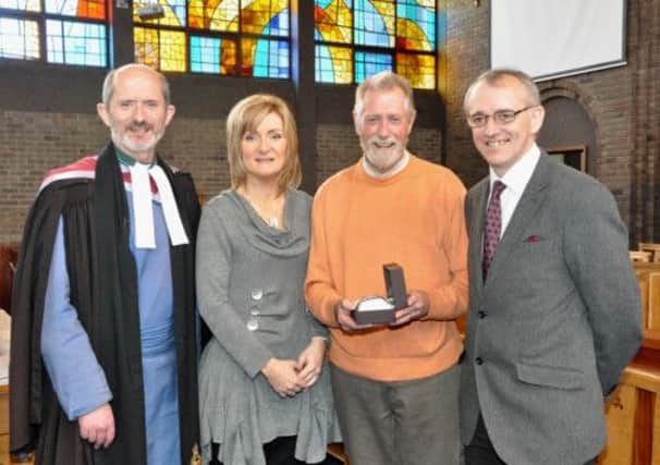 A presentation to mark over 50 years' service in First Larne Choir by Victor McDowell was made during morning service on Sunday May 5 by Kenneth McKinley, clerk of session. Also pictured is Rev Dr. Colin McClure, minister and Sheelagh Greer, organist and choir director. INLT 20-656-CON victor