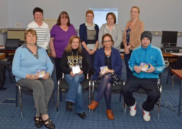 Eleanor Coyle (back row centre) from Supporting Communications NI pictured with participants who completed the Digital Champion training OCN Level 1 in computor essentials. INLT 18-003-PSB
