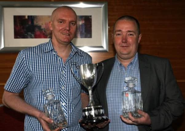 Drew Sloan, receives the Player of the Year, League Individual and the Tommy Nelson Cup from Gary Richardson (league treasurer) at the Ballymena Towers Pool League annual dinner. INBT20-226AC