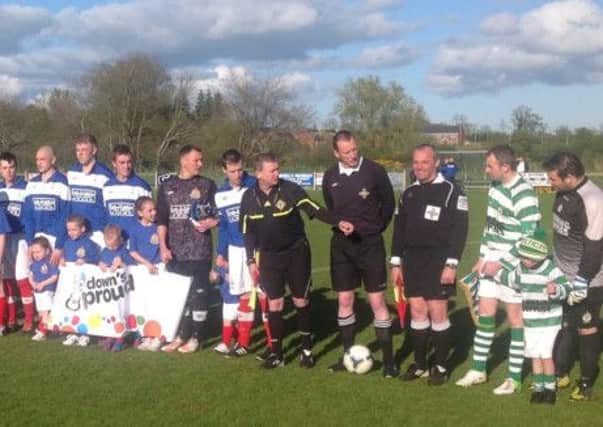 Rectory Rangers players and Celtic Club Lurgan Number One players come together before the cup final.