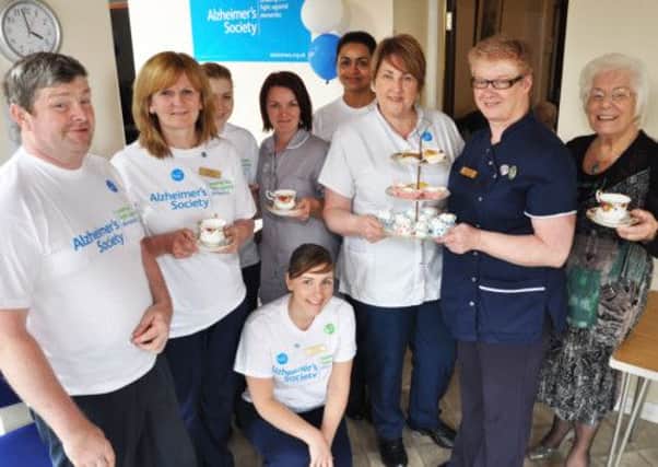 Director of Gillaroo Lodge Margaret Boyle, pictured with Nurse Manager Nicola McCrudden, staff and residents who enjoyed the Coffee Afternoon held in aid of the Altzheimers Society.  INLT 20-701-BM