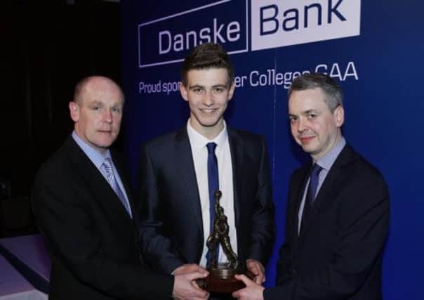 Shea Heffron (St Michaels Lurgan) is presented with his award by Michael McLaughlin Marketing Manager, Danske Bank and Seamus Meehan, Ulster Colleges Chairman.