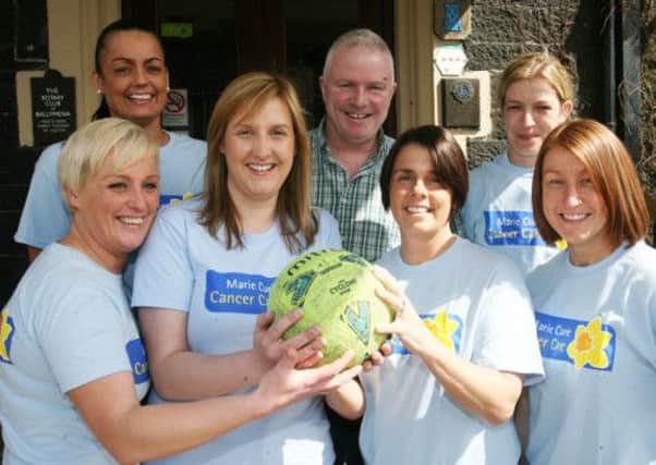 Anne McRoberts, of Marie Curie, is pictured with Ballymena All Star ladies football team original members Natasha Blair, Joanne Lennox,, Heidi Johnston, Wendy Dawson and Faye Green who are reforming for two charity matches. Included is Billy O'Flaherty. INBT17-208AC