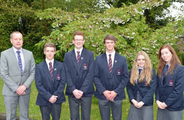 Larne Grammer School principal,Mr Wylie is pictured with (from left) deputy head boys,Michael Wilson and Michael Campbell,head boy James Bacon,deputy head girl Kirsty McKinty and head girl Judith Cameron,missing from photograph is deputy head girl Sarah Beath. INLT 20-002-PSB