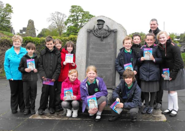 Valerie Beattie with Ballycarry children at the start of heritage trail. INLT 21-603-CON