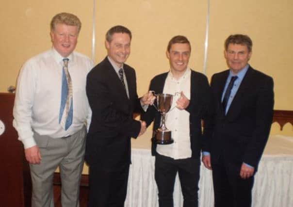 Conor Gregg, who won the Wakhurst FC Player of the Year, Players' Player of the Year and Leading Goalscorer awards, receives his trophy from North Antrim MLA Paul Frew. Also included are Billy Erwin (chairman) and Ian Gregg (manager).