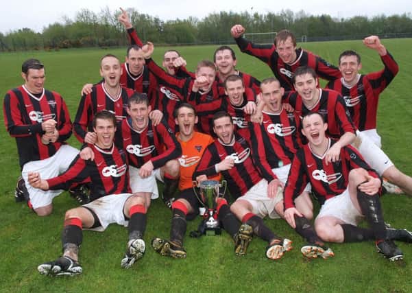 The Drumahoe players celebrate after lifting the O'Bryan Cup at Wilton Park on Saturday. INLS2113-151KM