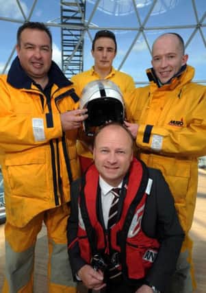 Barry Kirkpatrick, crew member at Larne RNLI (back, right), with Robert Latus, assistant mechanic at Newcastle RNLI, Rogan Wheeldon, senior RNLI lifeguard on the Causeway coast, and Hugh Black (front), Victoria Square centre manager. Picture: Paul Fee,